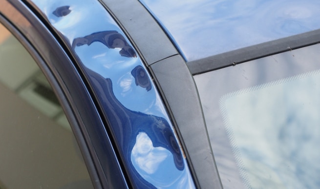 Hail damage on side door could devalue your car or vehicle significantly